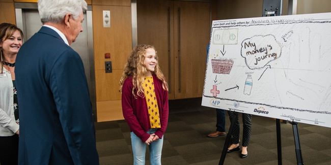 Lauren Gehl, one of three winners of Dupaco's Philanthropy Day poster contest explains how she gives back.